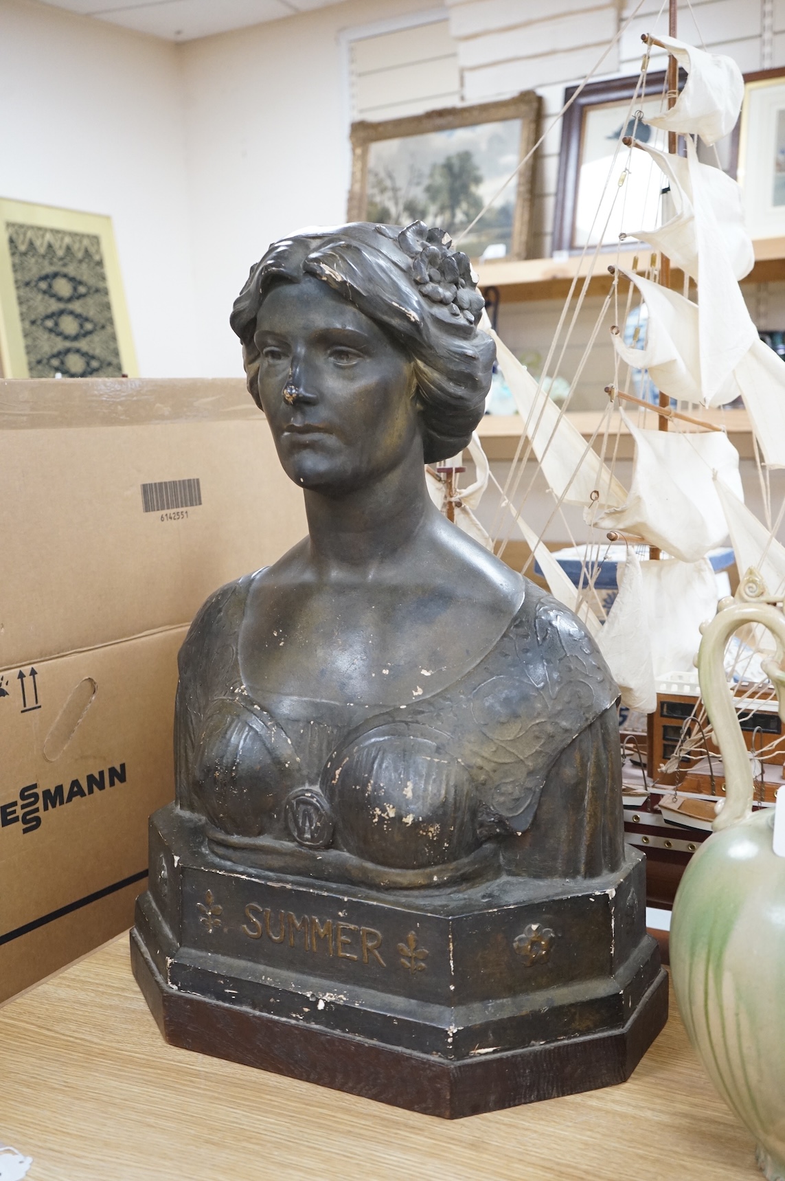 An early 20th century bronzed plaster bust 